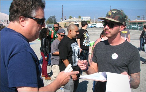 A California resident and Cannabis Cup attendee hesitates to sign a 2014 pot legalization petition Feb. 8, citing a need for more information